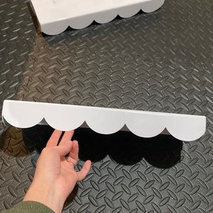 Two Crate and barrel scalloped shelves